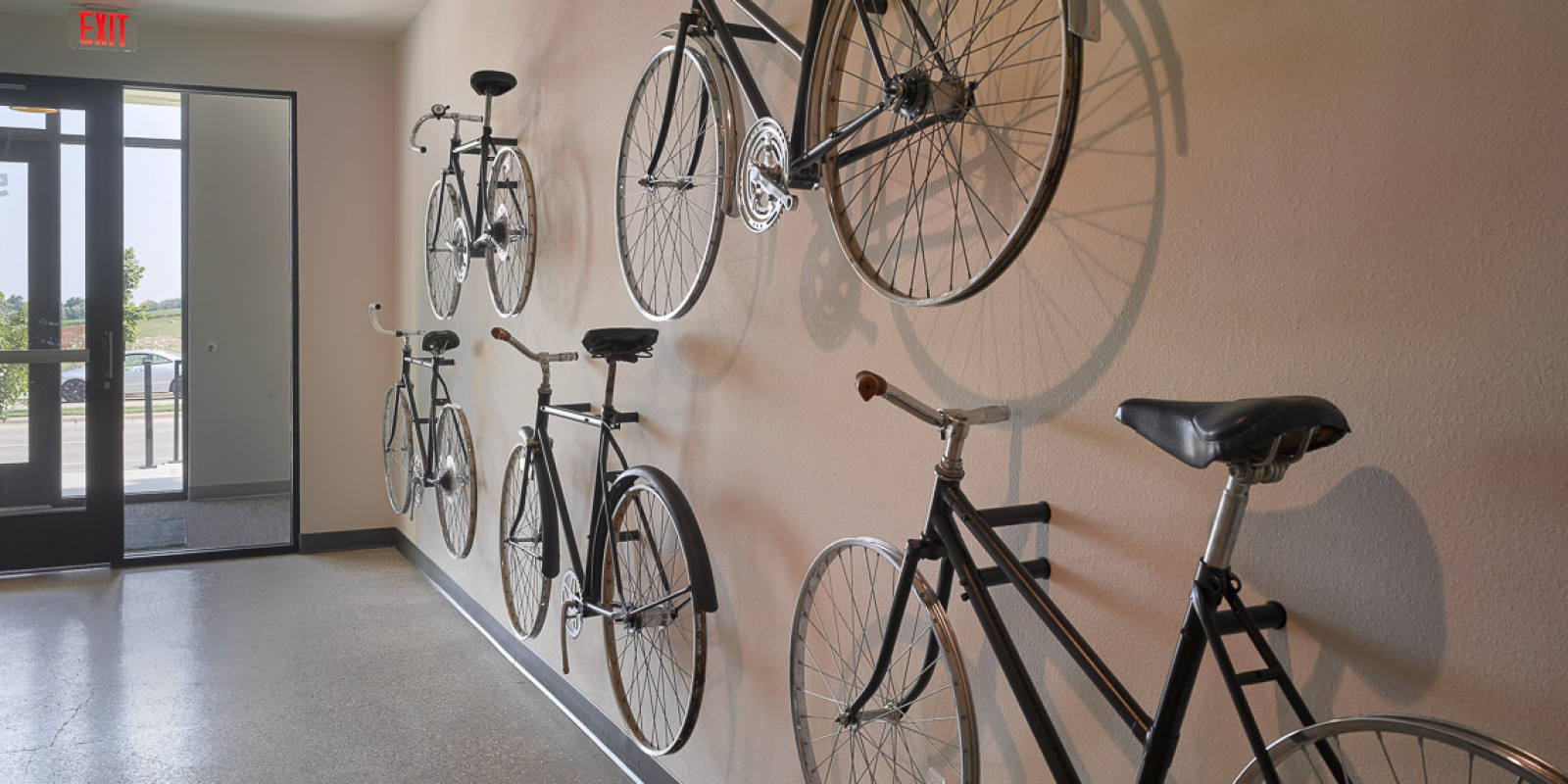 bicycle art mounted to interior wall at Prima apartments in Fitchburg, WI